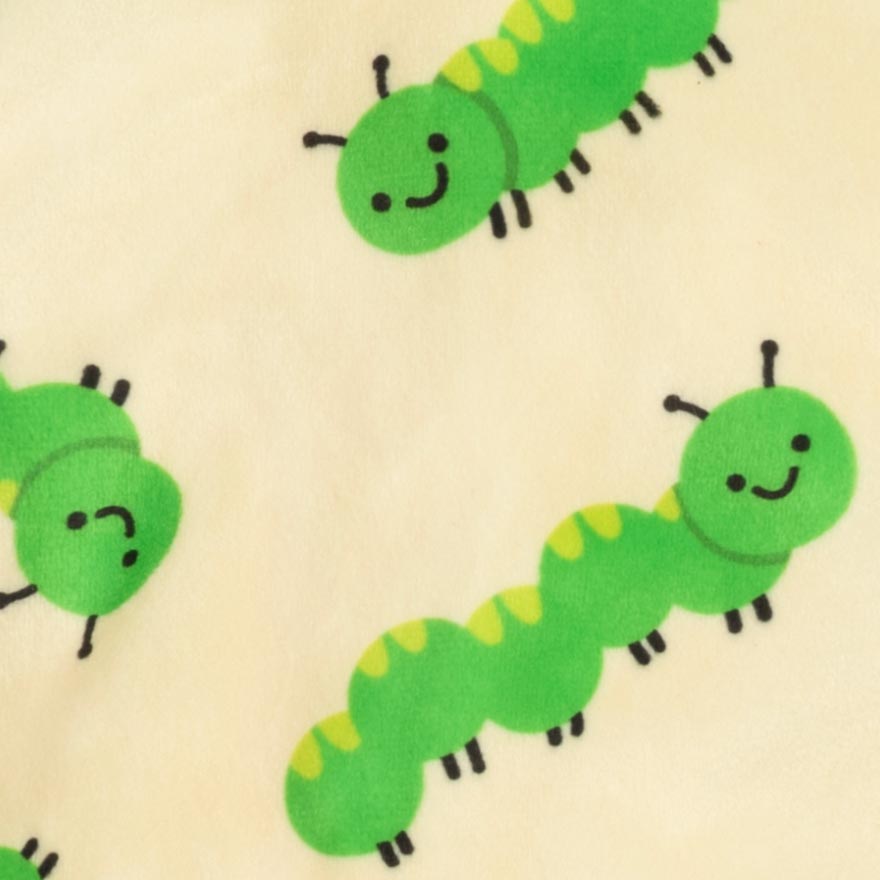Caterpillar print detail on dog pajamas fabric, smooth velvet finish