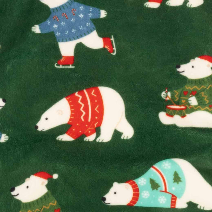 Green dog pajamas with polar bear pattern, featuring bears in festive sweaters.