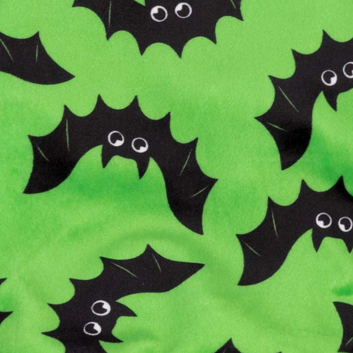 Soft lime green fleece fabric with black cartoon bat prints and white cartoon eyes, ideal for Halloween dog apparel.