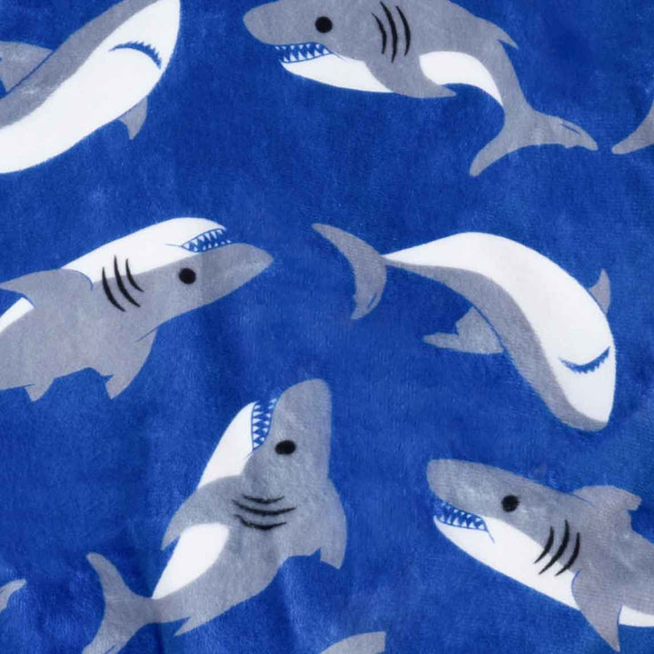 Pattern of sharks on a blue background