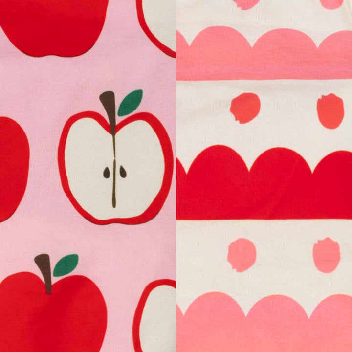 Close up of apple and stripe prints on colorful dog shirt fabric for dogs