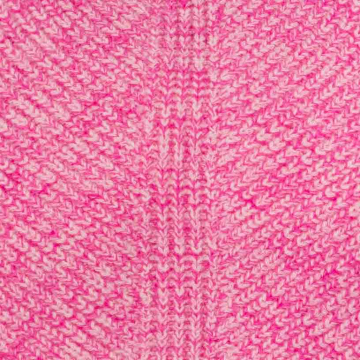 Detailed view of pink herringbone knit pattern on dog sweater fabric.