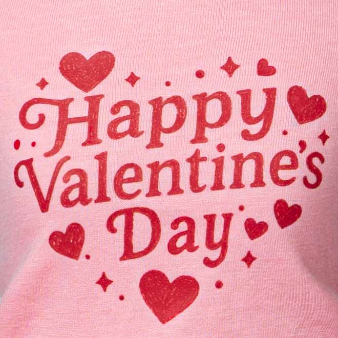 Happy Valentine’s Day lettering detail on a pink dog dress with decorative heart graphics.