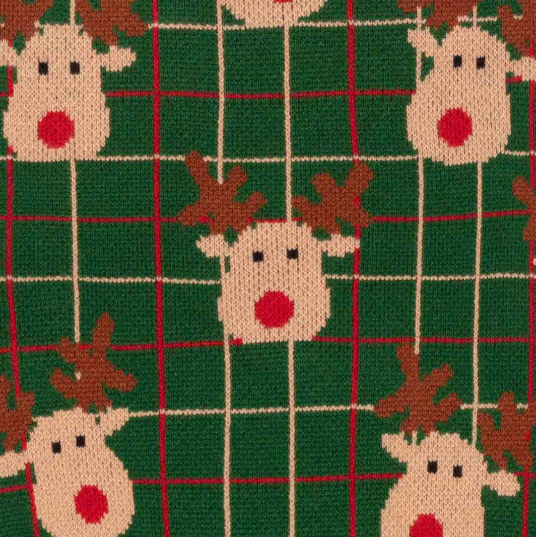 Close-up of a knitted fabric featuring a festive Christmas pattern with reindeer faces and a green plaid grid