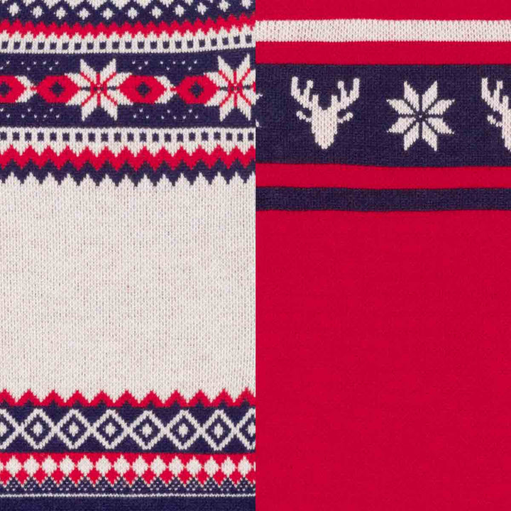Close-up of a knit holiday dog sweaters fabric with a red, navy, and white Fair Isle pattern on the left and a solid red section with a navy band and white snowflake and deer motifs on the right