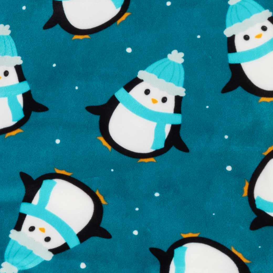 Teal blue penguin dog pajamas fabric detail. Soft fleece with penguin print, perfect for small dog comfort