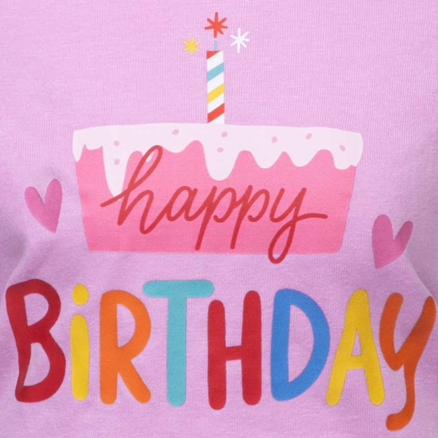 Happy Birthday lettering with a cake and candle on a pink background