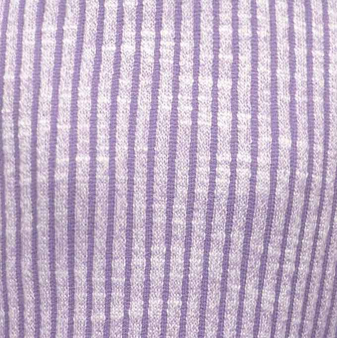 Close-up of lavender and white ribbed fabric used in the stylish purple dog dress.