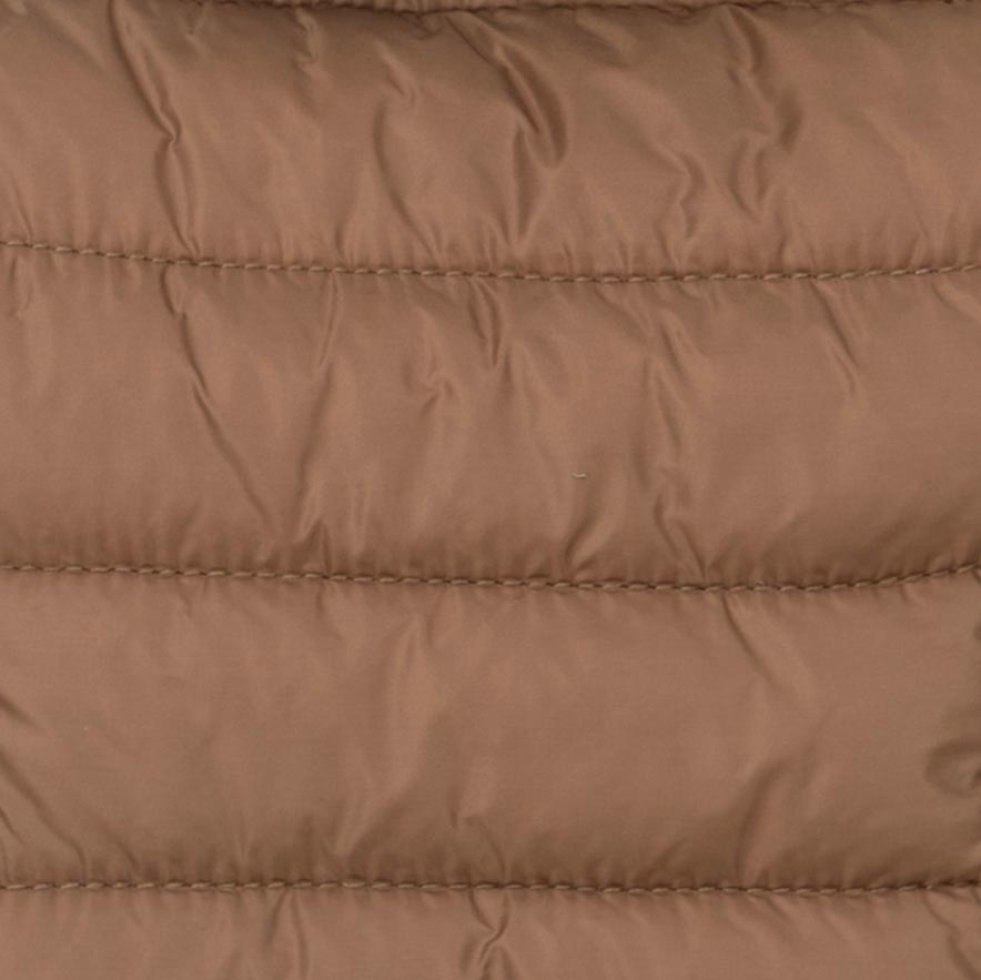 Detailed view of padded shell fabric used in brown Dog hoodie, designed for warmth.