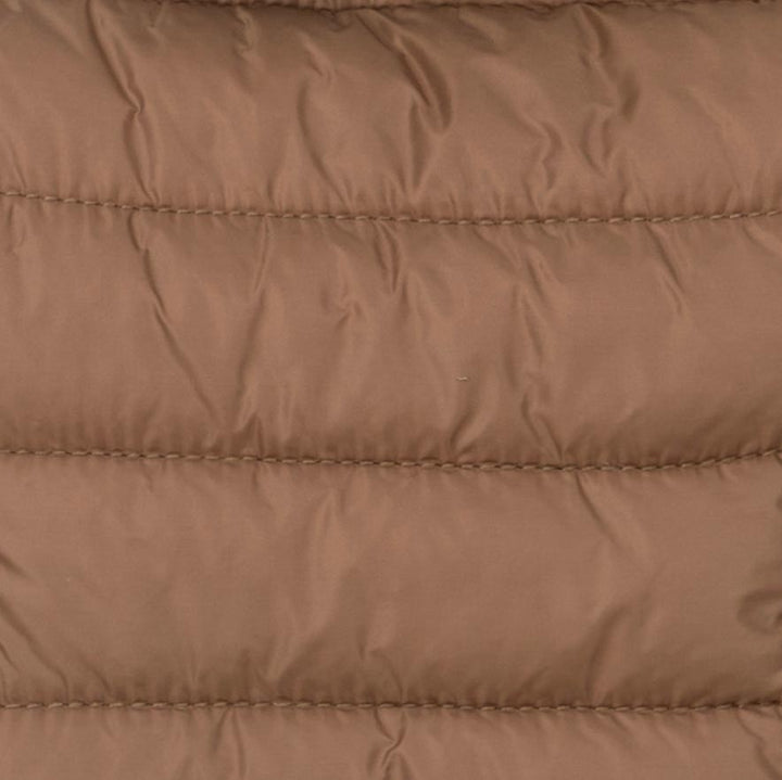 Detailed view of padded shell fabric used in brown Dog hoodie, designed for warmth.