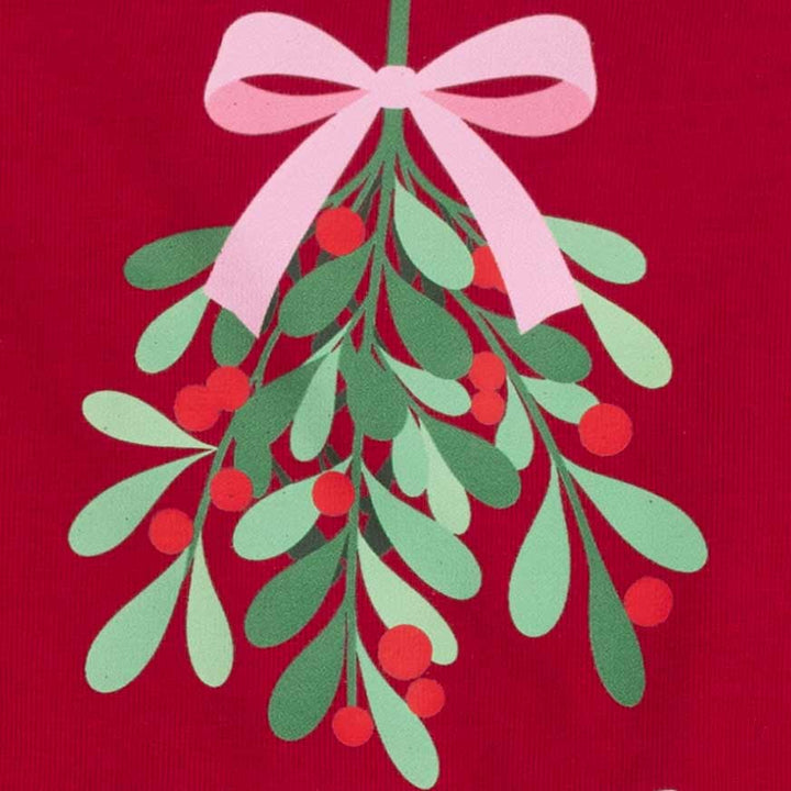 Festive Christmas mistletoe design printed on a red fabric background, featuring green leaves, red berries, and a light pink bow at the top