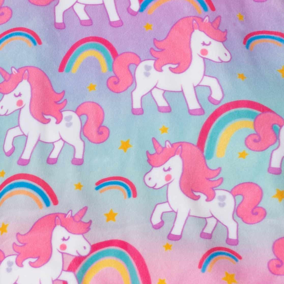 White unicorns with pink manes and tails on a pastel blue and pink tie-dye background with rainbow arches and yellow stars.