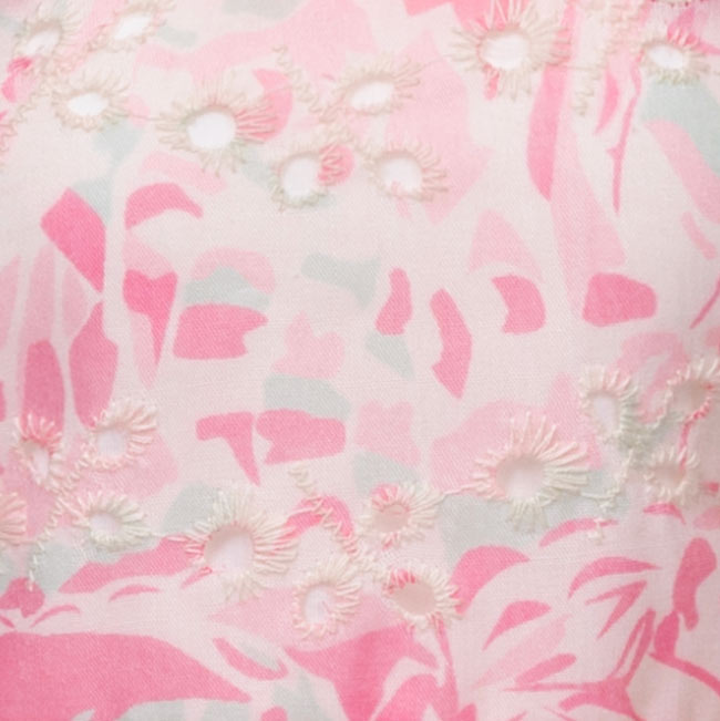 Close-up of pink floral fabric with a subtle pattern
