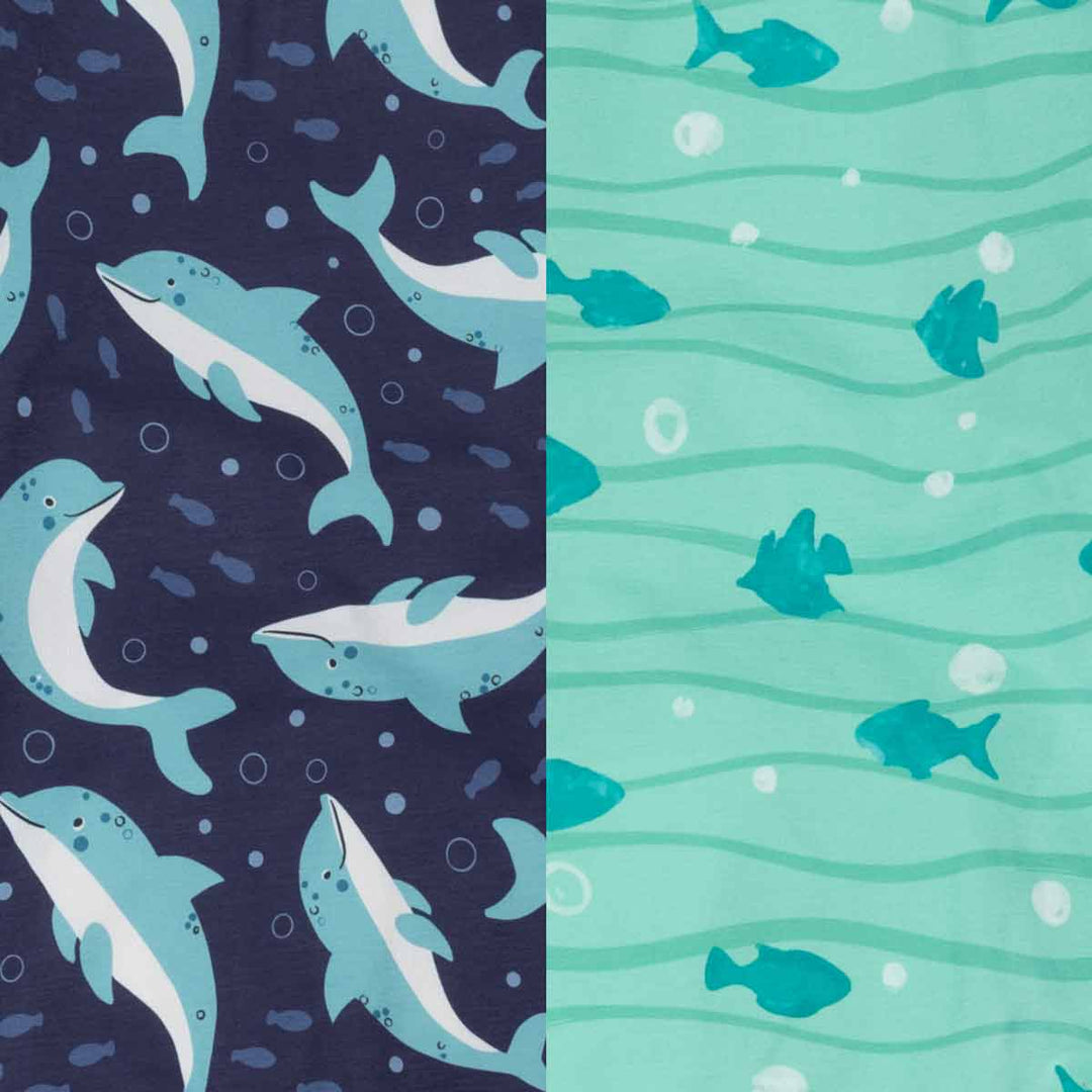 Two dog shirts patterns with dolphins on a blue background and fish on a green background
