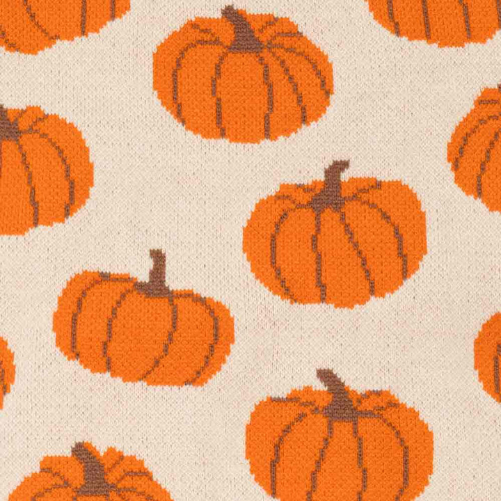 Pattern of orange pumpkins with brown stems on a beige background