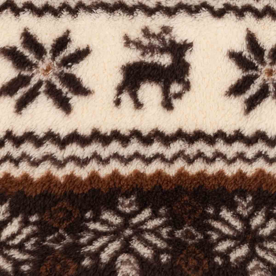 Close-up of a textured knit fabric with a Nordic pattern featuring a reindeer, snowflakes, and geometric stripes in cream, dark brown, and rust brown