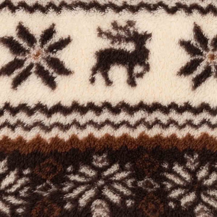 Close-up of a textured knit fabric with a Nordic pattern featuring a reindeer, snowflakes, and geometric stripes in cream, dark brown, and rust brown