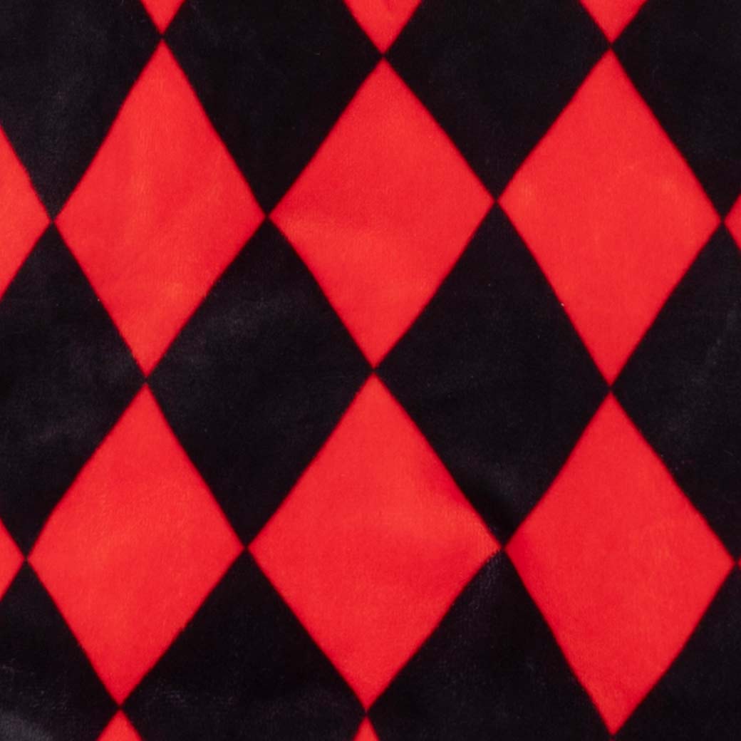 Close-up of a red and black harlequin diamond patterned fabric, showing a soft plush or velour texture