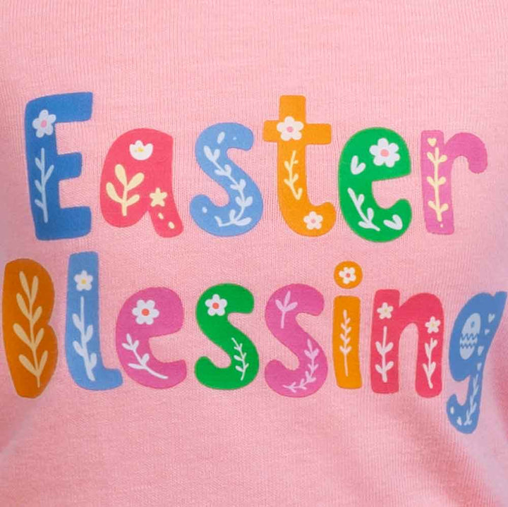 A colorful dog dress with "Easter Blessing" print and rainbow gingham skirt.
