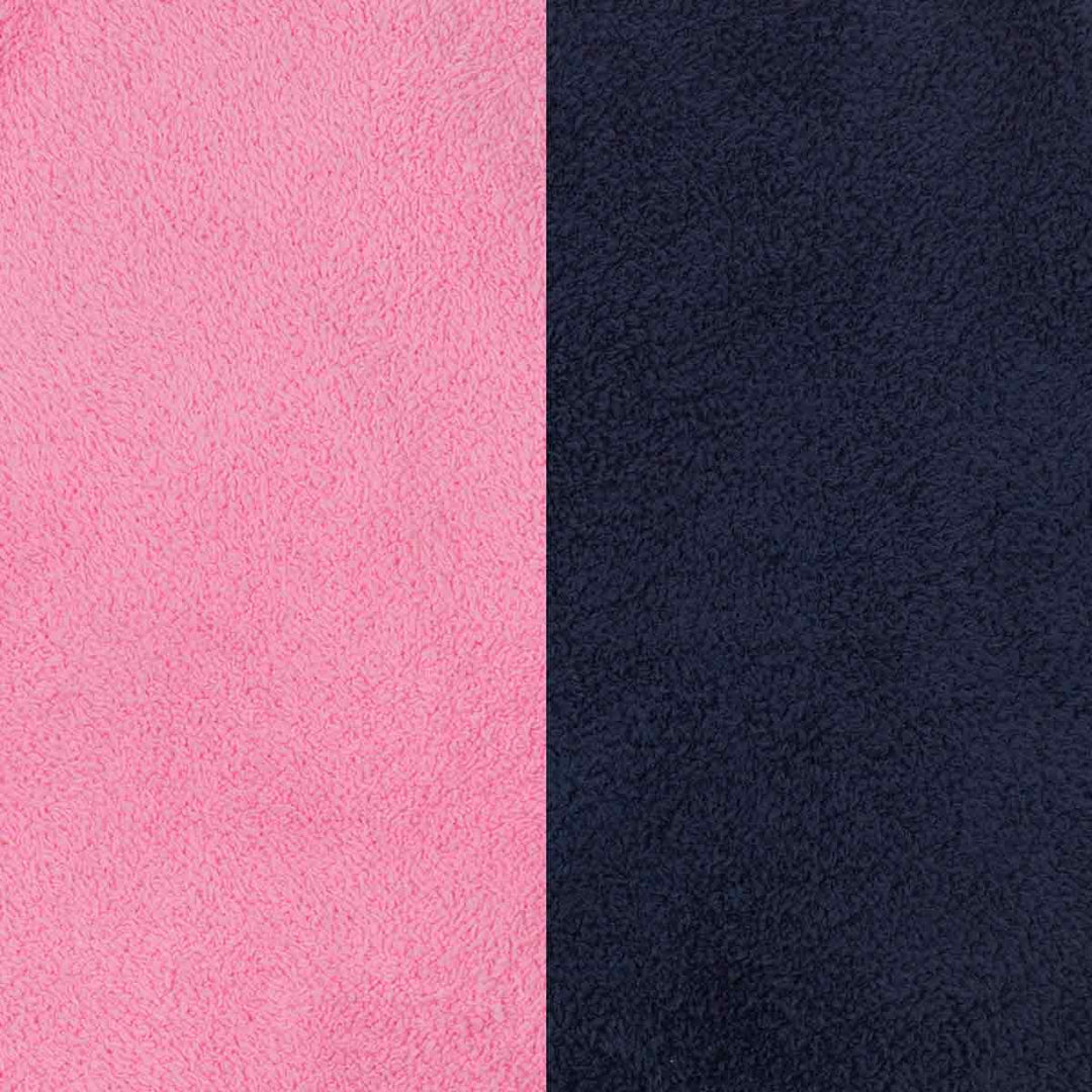 Close-up view of two textured fabric surfaces: a bright pink material on the left and a dark navy material on the right