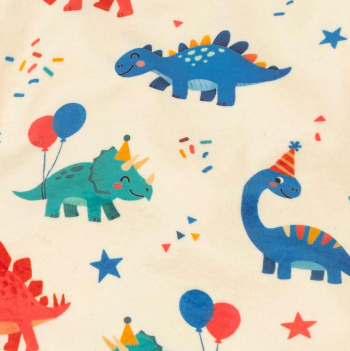 Colorful pattern of cartoon dinosaurs with balloons and confetti on a beige background
