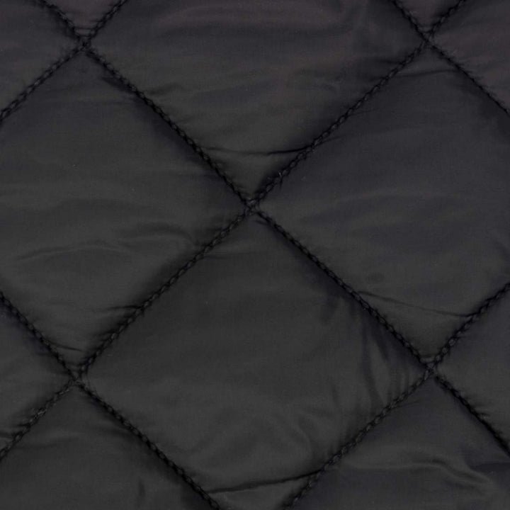 Close-up of black quilted dog coat showing diamond stitching pattern on smooth, slightly lustrous polyester fabric.