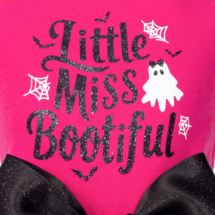 Pink Little Miss Bootiful dog dress with sparkly text, ghost, bat, spiderweb graphics and black glittery bow.