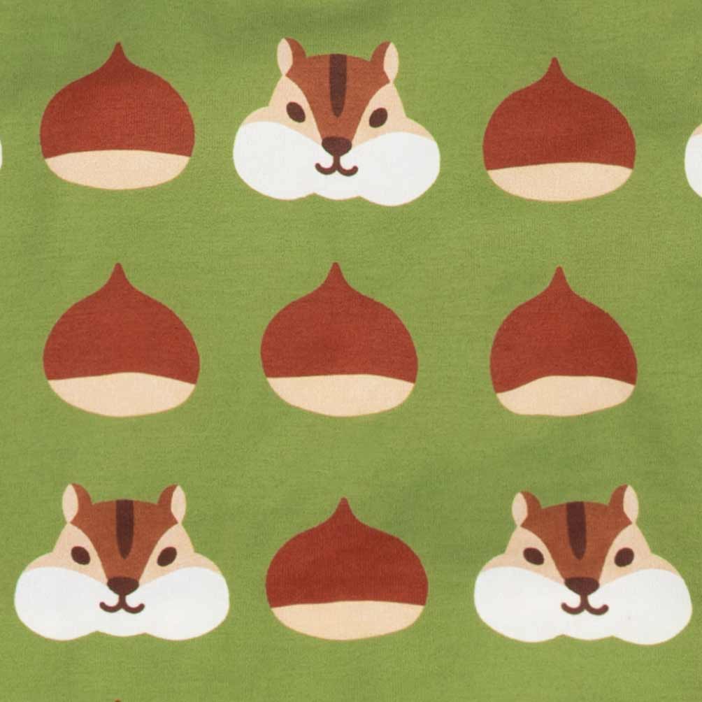 Close-up of a green fabric on dog tank top with a repeating pattern of brown acorns and squirrel faces
