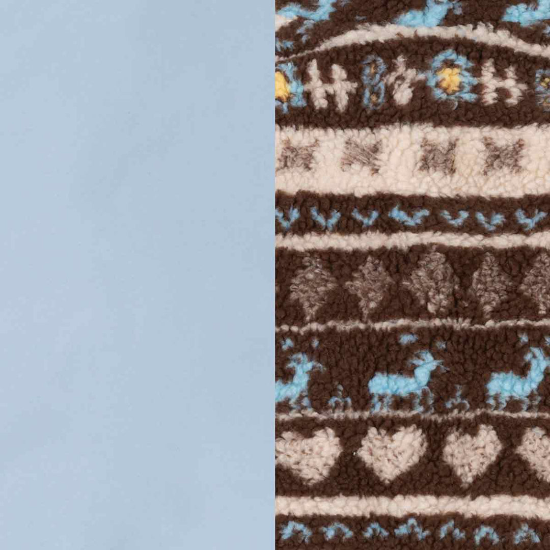 Close-up of a patterned knit fabric with horizontal bands in brown, cream, light blue, and small yellow accents, alongside a solid light blue section on the left