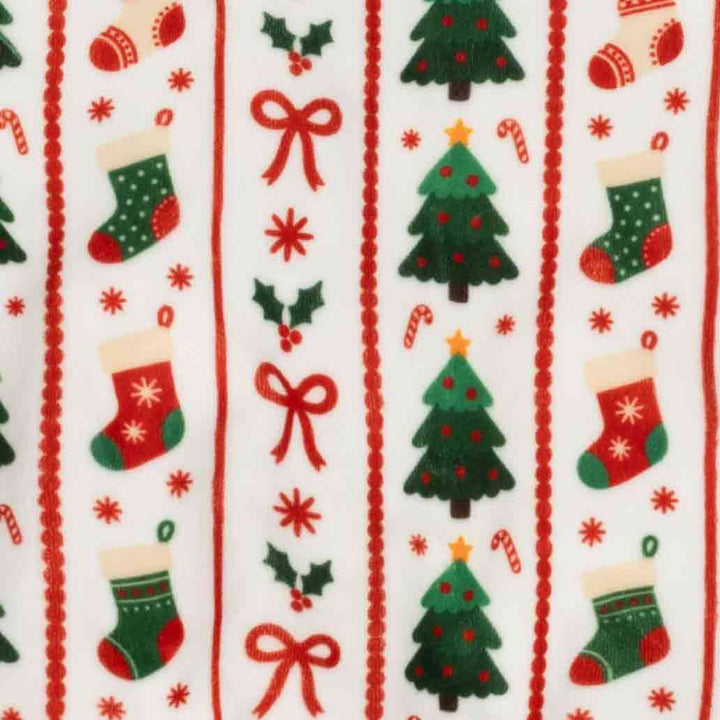 Close up of Christmas themed prints on festive dog onesie