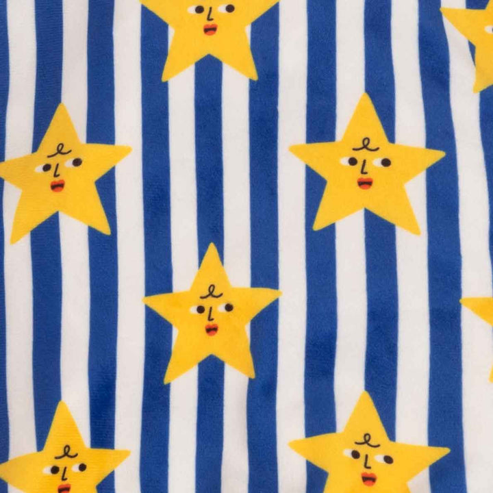Close up of stripe and star prints on dog onesie