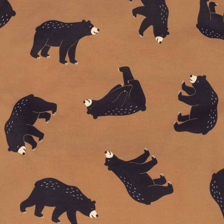 Repeating pattern of stylized black bears with white accents on a warm tan background
