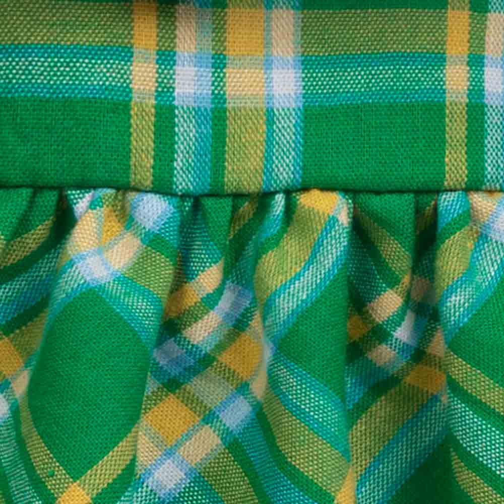 Close-up of green and yellow checkered fabric dog dress