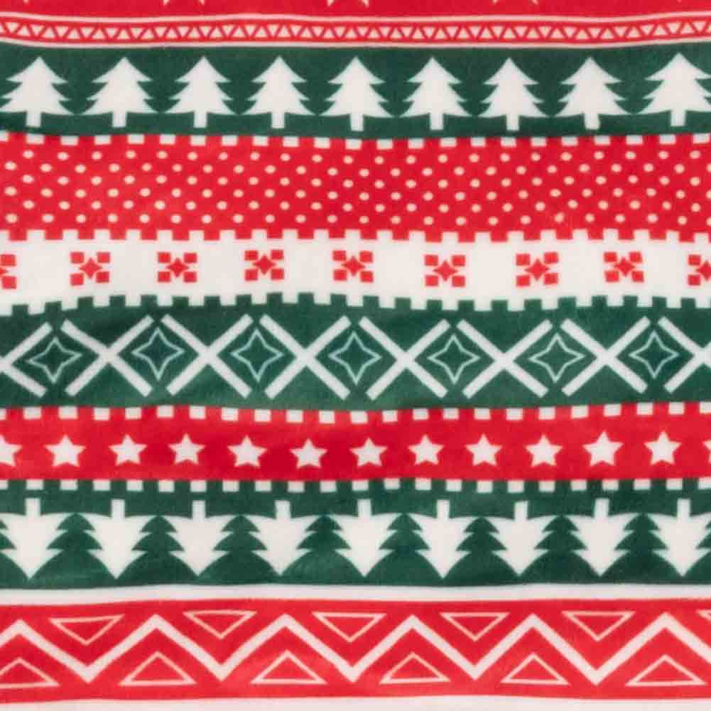 Close up of red, green, and white fabric on festive dog onesie with Christmas tree and white polka dots