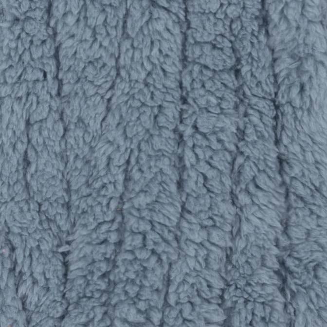 Detailed view of ribbed sherpa texture in blue dog pajamas fabric.