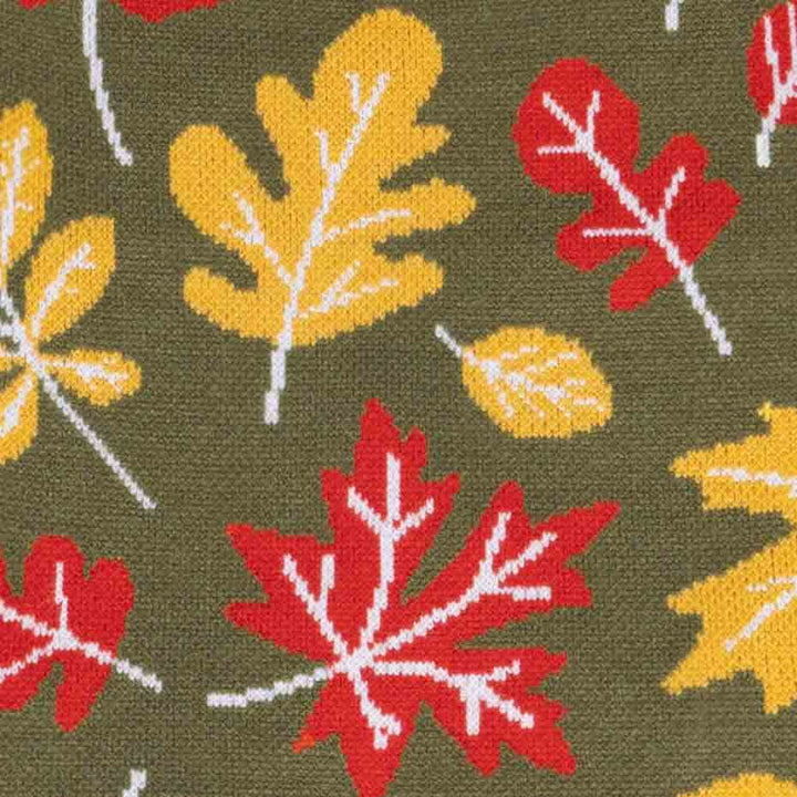 Pattern of red, yellow, and white leaves on a green background