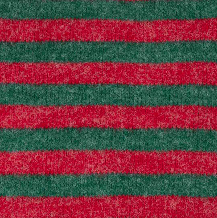 Close-up of a textured fabric with stripes in red and green