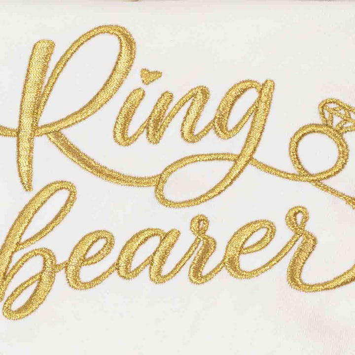 Detailed view of embroidered Ring Bearer lettering on white dog bandanas