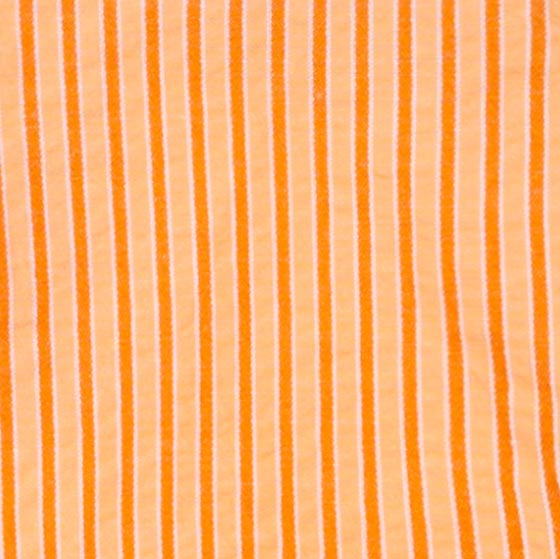 Close-up of orange fabric with thin vertical stripes