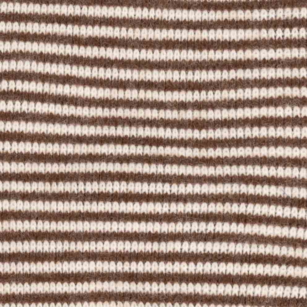 Close-up of a knitted fabric with horizontal stripes in dark brown and off-white