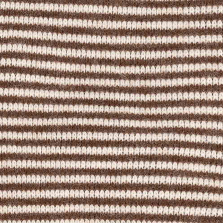 Close-up of a knitted fabric with horizontal stripes in dark brown and off-white