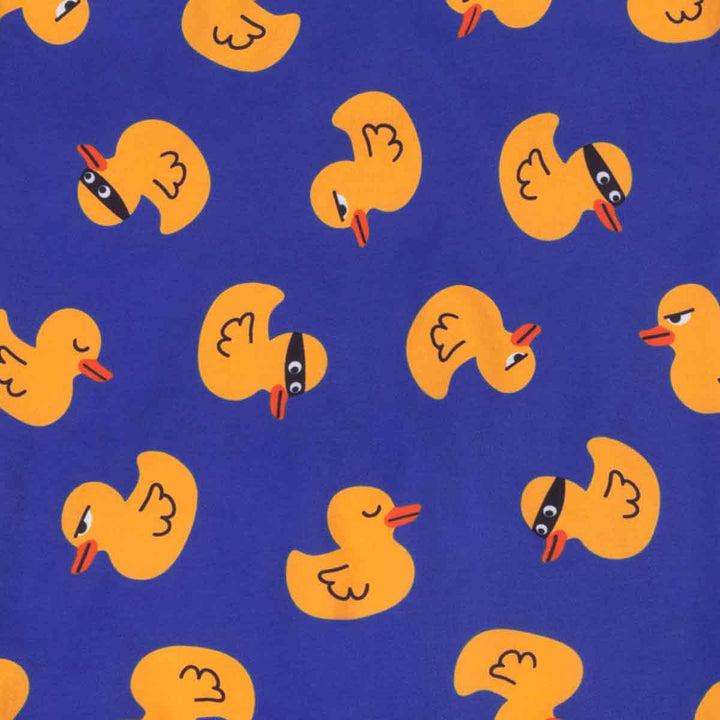 Pattern of yellow rubber ducks with on a blue background