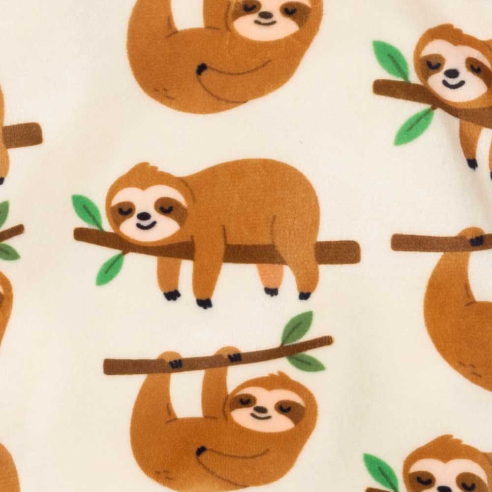 Close-up view of the sloth graphic pattern printed on the dog pajamas fabric.