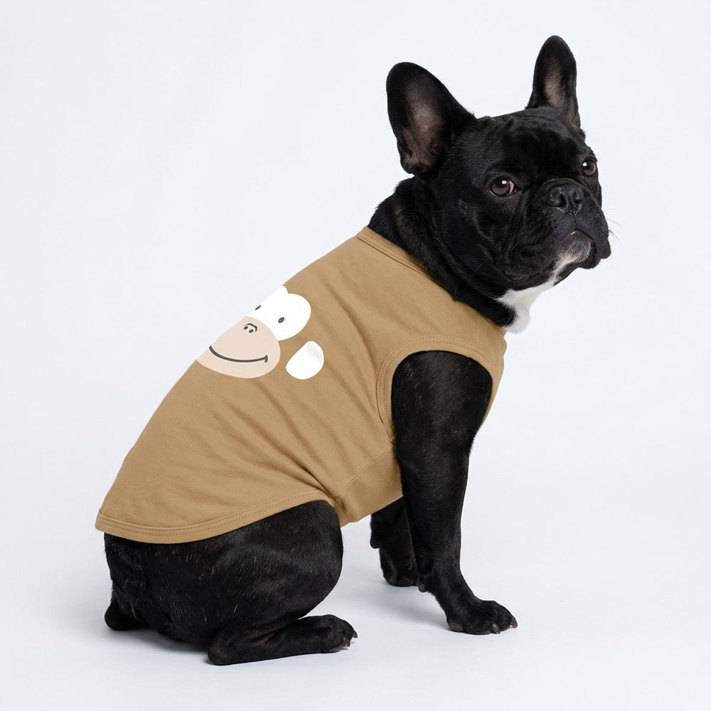 Side view of French bulldog modeling brown dog tshirt with cartoon gorilla design