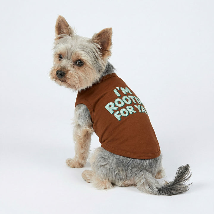 Side view of dog wearing sleeveless dog tee with supported lettering