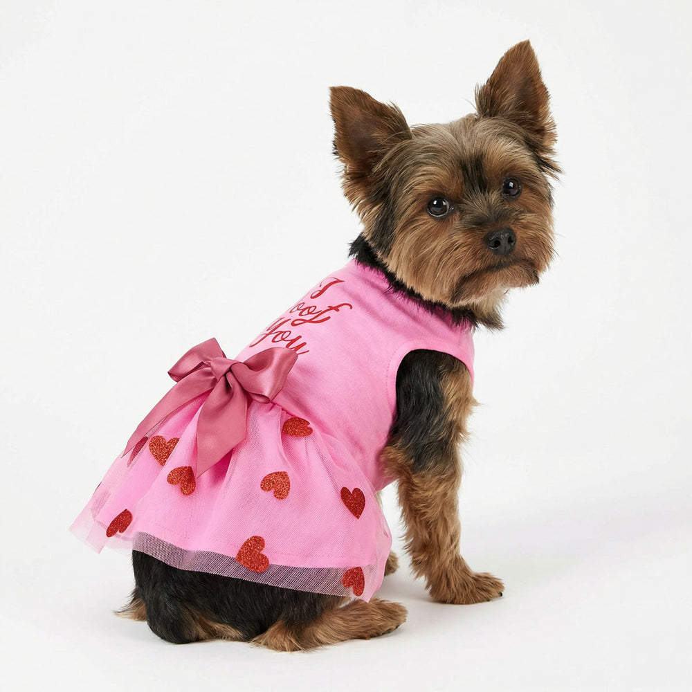 Yorkie wearing a pink dog tutu dress with 'I woof you' lettering and bowknot