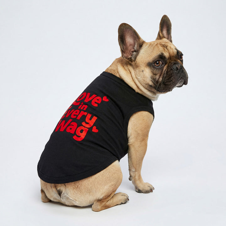 French bulldog in a Valentine dog tank top with red ' Love in every wag' lettering and heart prints