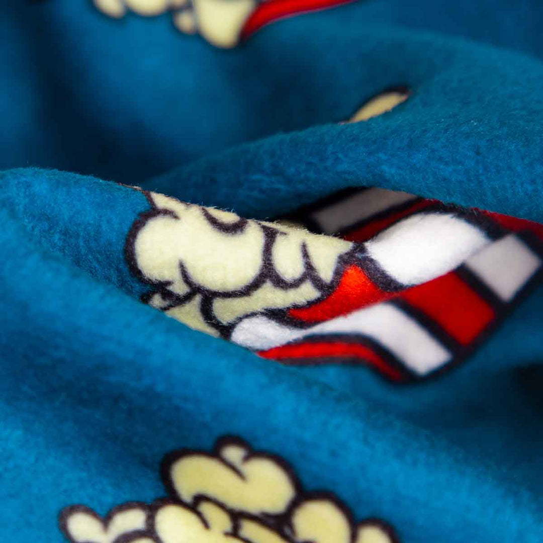Close-up of blue popcorn dog pajamas fleece material with popcorn design, ideal for comfortable dog clothes.