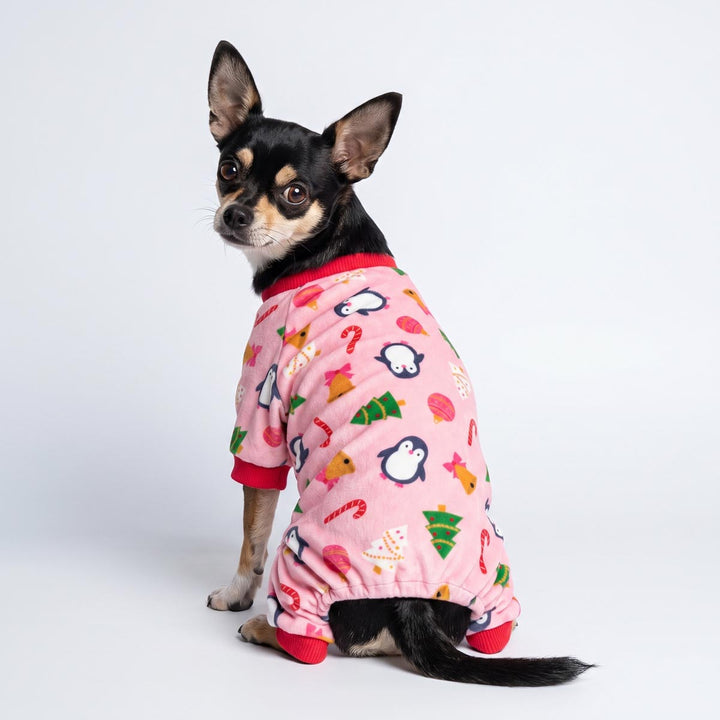 Back view of Chihuahua in a Christmas dog pjs with penguin and other festive patterns