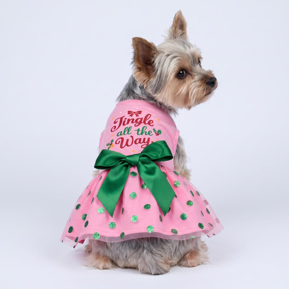 Back view of Yorkie wearing a Christmas dog tutu with 'Jingle all the way' lettering, bow and polka dot details